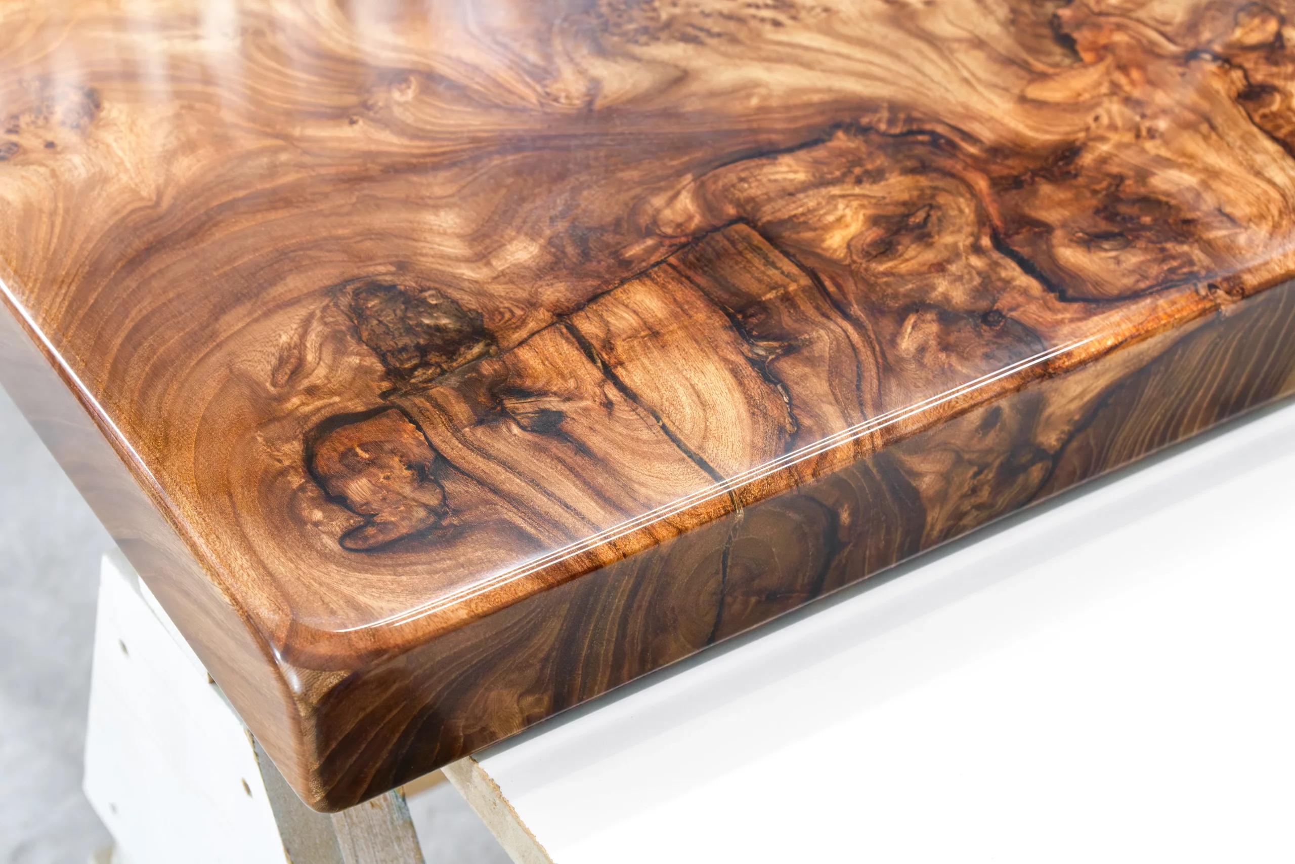 Wood surface showing signs of moisture damage, scratches, and UV discoloration